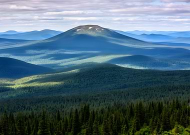 Sunlit Mountain Peaks and Forests