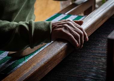 Hands Weaving on a Loom