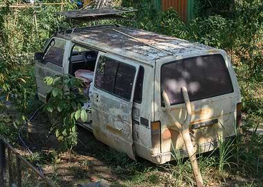 Abandoned Van in Overgrown Garden