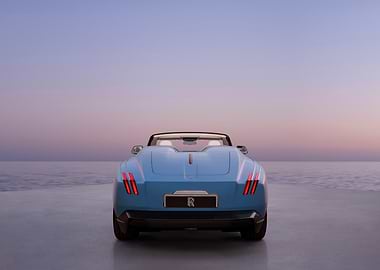 Blue Rolls-Royce convertible by the sea