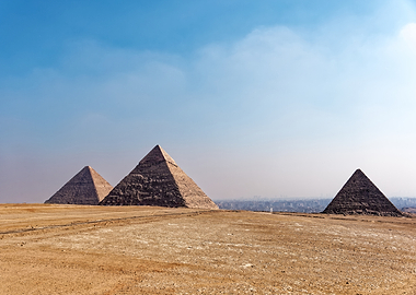 Pyramids of Giza under a blue sky