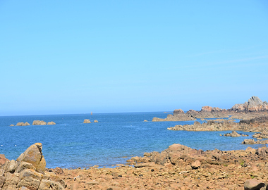 Rocky Coastline Under a Clear Blue Sky