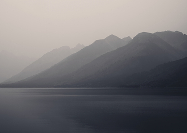 Misty Mountains Over Calm Lake