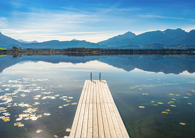 Wooden Pier on a Calm Lake with Mountains