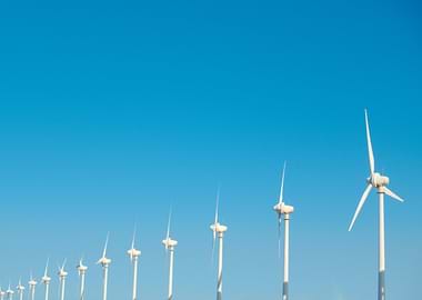 Wind Turbines Against Blue Sky
