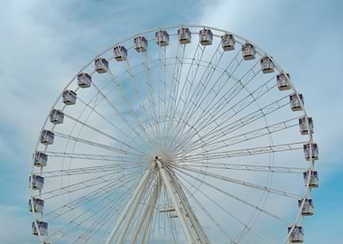 Ferris Wheel Against Blue Sky