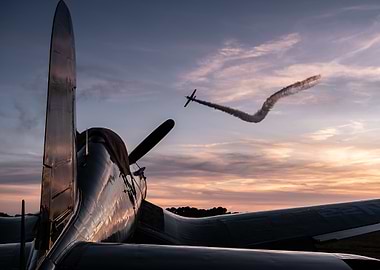 Airplane performing aerobatics at sunset