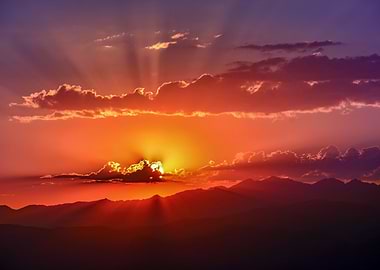 Sunset Over Mountains with Sun Rays
