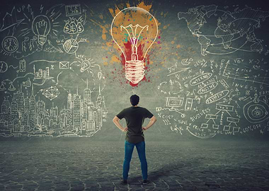 Man facing a bright idea lightbulb