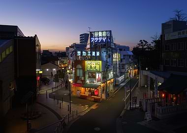 Neon-lit Japanese Izakaya in Ikebukuro (Tokyo) street at dusk