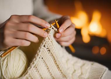 Knitting by the Fireplace