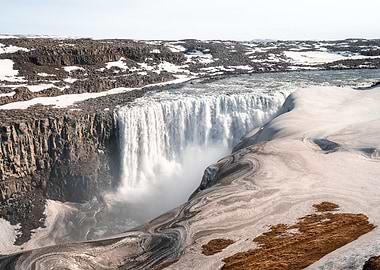 Hafragilsfoss Waterfall in Snowy Landscape