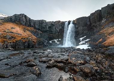 Gufufoss Waterfall in a Rocky Landscape