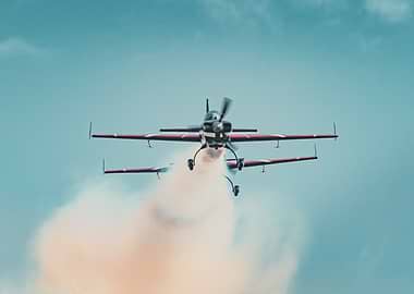 Aerobatic Biplanes Performing a Smoke Show