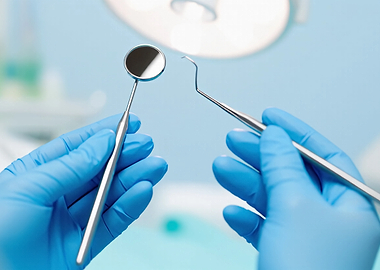 Dentist's Hands with Tools