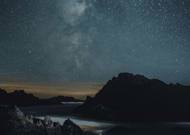 Starry Night Over Mountains and Clouds