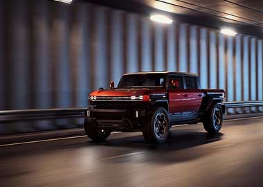Red GMC Hummer EV Pickup Truck in Tunnel