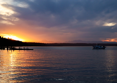 Summer Sunset With Boat on a calm evening bay