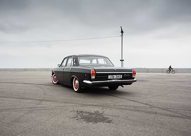 Classic Black Volga in huge asphalt lot