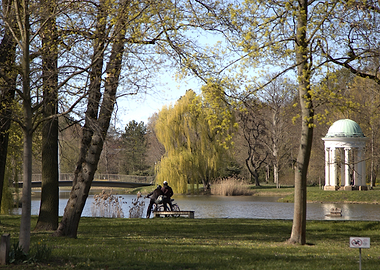 Park scene with people by the lake