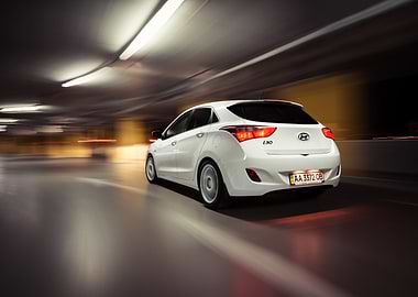 White Hyundai i30 driving in parking garage