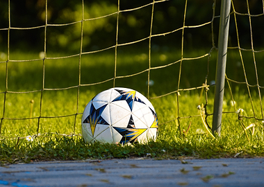 Soccer ball near goal net