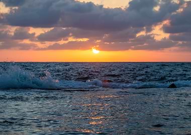 Golden Sunset Over Crashing Ocean Waves