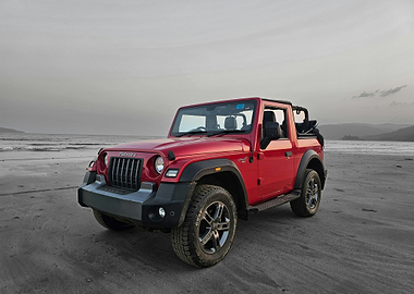 Red Mahindra Thar on Beach