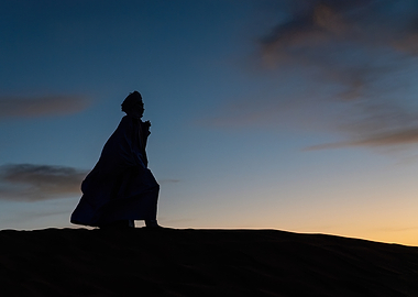 Silhouette of a Person in Desert