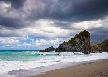 Dramatic Rocky Beach Under Stormy Skies