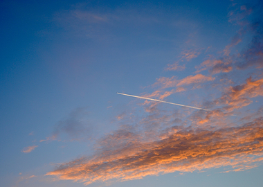 Airplane Contrail in Sunset Sky