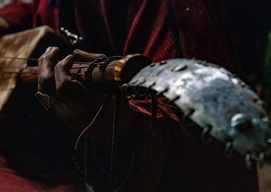 Traditional Musician Playing Stringed Instrument