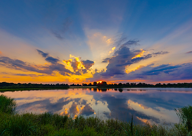 Vibrant Sunset Over Calm Lake