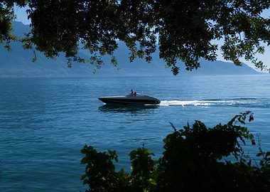 Speedboat cruising on a calm lake Leman
