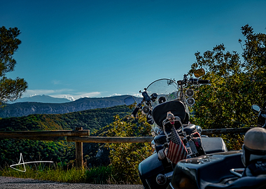 Motorcycle parked overlooking mountain landscape