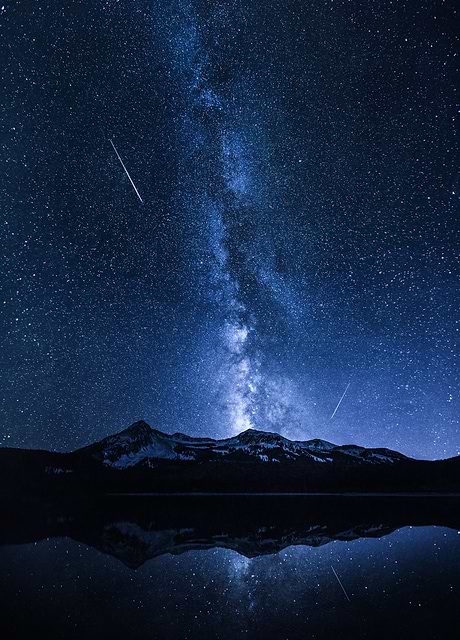 This captivating digital artwork titled Galaxies Reflection takes viewers on a mesmerizing journey through the night sky. 