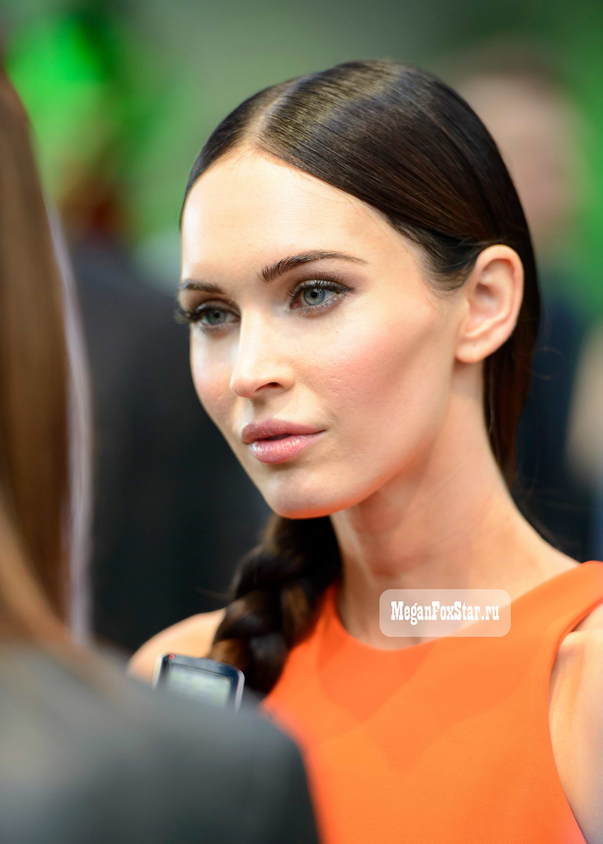 megan fox orange dress Megan Fox flashes her taut waist and tattoos in orange cut-out dress